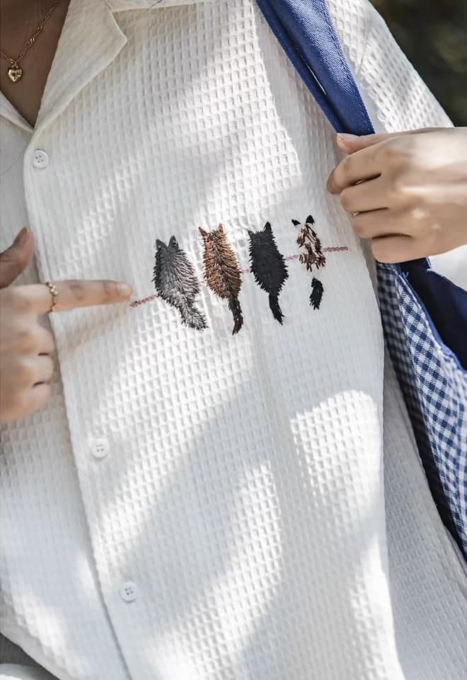 White cat-embroidered shirt